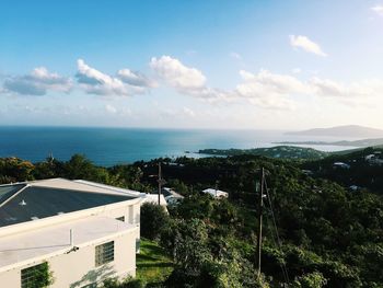 High angle view of building by sea against sky