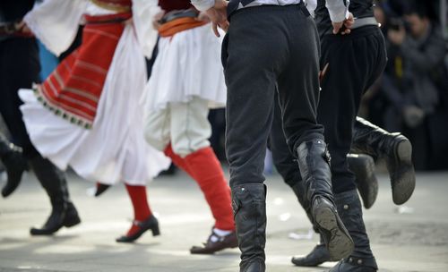 Low section of people dancing in traditional clothing