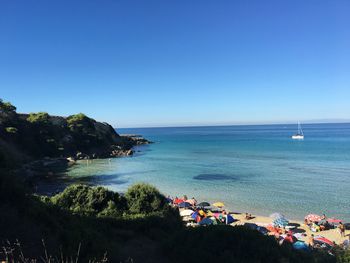 Scenic view of sea against clear blue sky