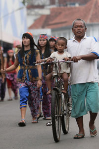 Crowd on street in city