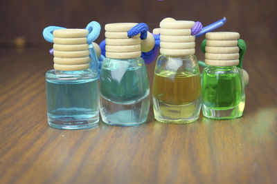 Close-up of multi colored medicine bottles on table