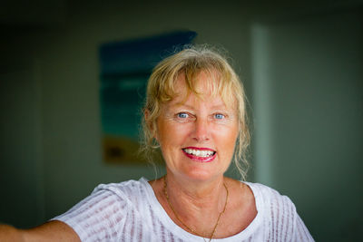 Portrait of smiling woman with blue eyes