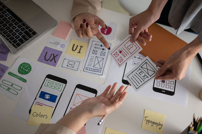 High angle view of business colleagues working on table