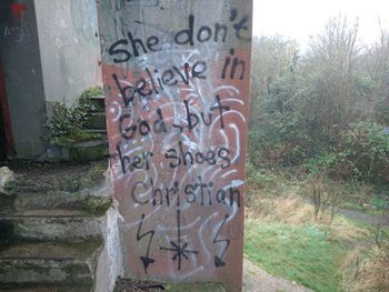 Close-up of text on wall