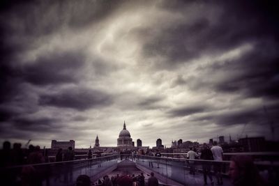 Buildings against cloudy sky