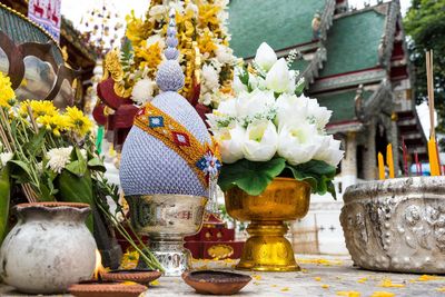Close-up of floral offerings at a temple in chiang rai thailand