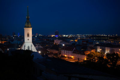 High angle view of illuminated buildings in city at night