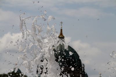 Close-up of water drops against sky
