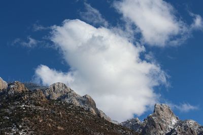 Low angle view of rocks against sky