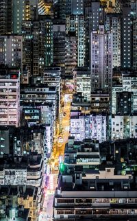 High angle view of city lit up at night