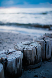 Closeup of groynes leading in the ocean