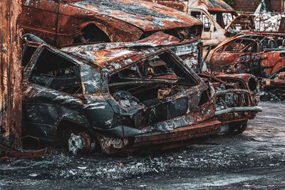 Rusted burnt out car wrecks