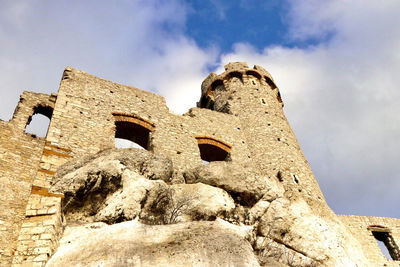 Low angle view of old building against sky