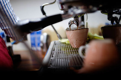 Close-up of hand holding coffee cup