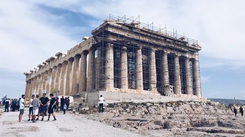 Group of people in front of historical building