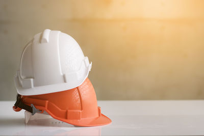 Close-up of hardhats on table