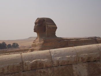 Statue of historical building against clear sky