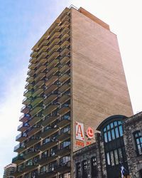 Low angle view of skyscraper against sky