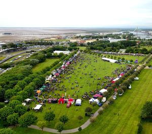 High angle view of crowd and buildings against sky