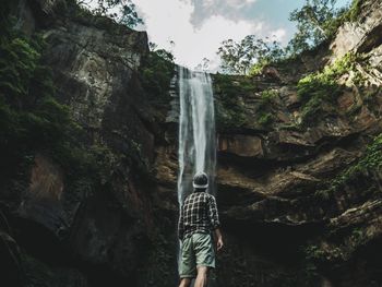 People standing on rock formation