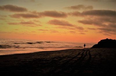 Scenic view of beach during sunset