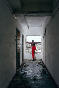 Rear view of man in abandoned building