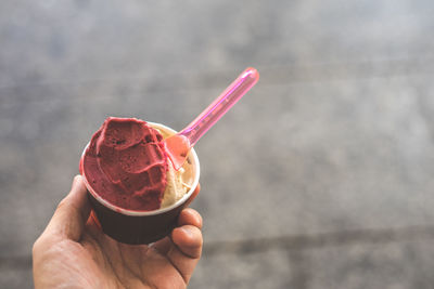 Hand holding ice cream cone