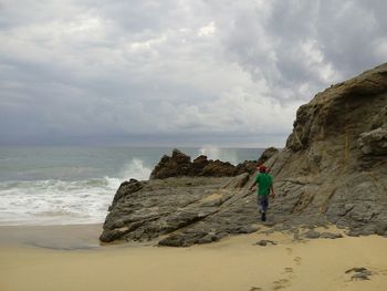 Scenic view of sea against cloudy sky