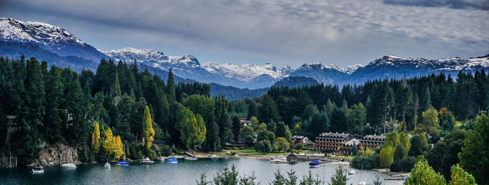 Panoramic view of trees and mountains against sky