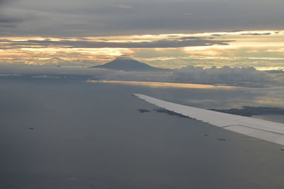 Aerial view of mountains against sky during sunset