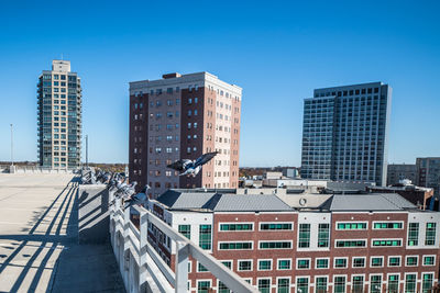 View of downtown new brunswick, new jersey on a clear sunny fall day. flying pigeons can be seen.