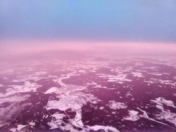 Aerial view of frozen sea against clear sky during winter