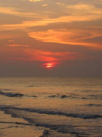 Scenic view of beach against sky during sunset