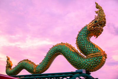 Low angle view of statue against sky