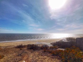 Scenic view of sea against cloudy sky