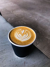 High angle view of cappuccino on table