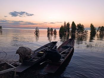 Scenic view of lake against sky during sunset