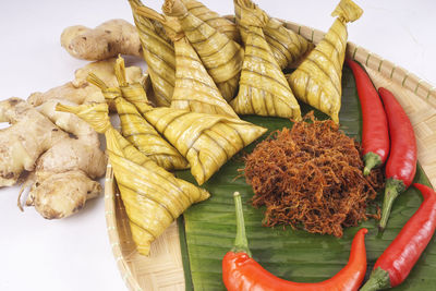 High angle view of vegetables on table against white background