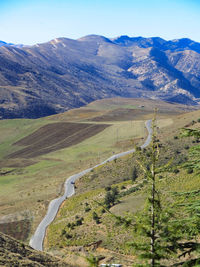 Scenic view of landscape and mountains against sky