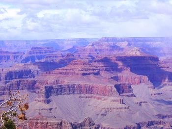 High angle view of rock formations against cloudy sky