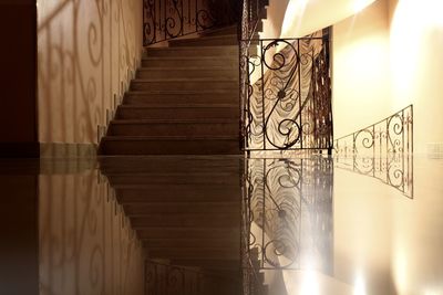 Reflection of steps on flooring in building