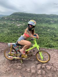 High angle view of woman standing on mountain