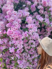 Rear view of woman wearing flowers