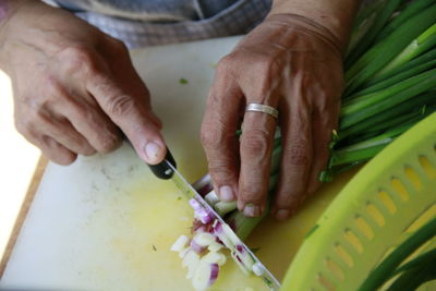 High angle view of man preparing food on table