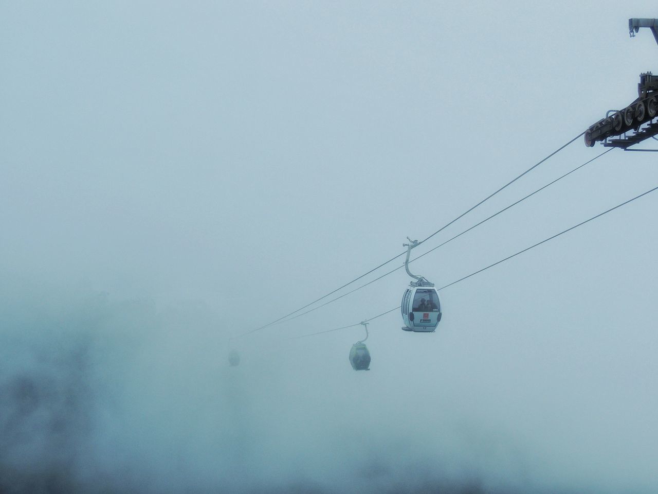 LOW ANGLE VIEW OF OVERHEAD CABLE CAR