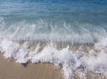 High angle view of waves splashing on shore