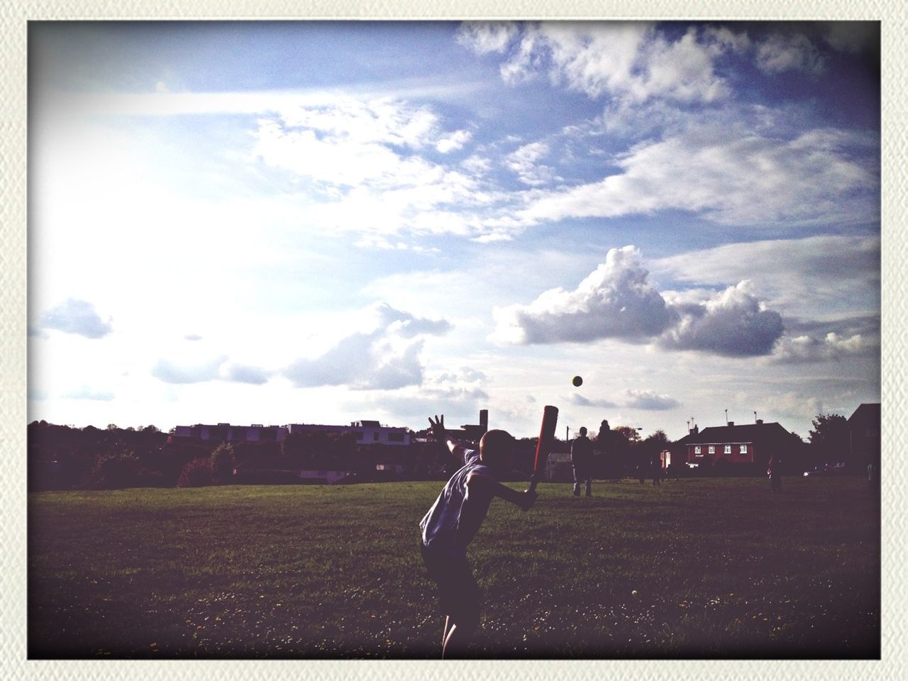 transfer print, sky, auto post production filter, cloud - sky, field, landscape, grass, cloud, cloudy, leisure activity, lifestyles, rural scene, sport, grassy, transportation, nature, tranquil scene, men