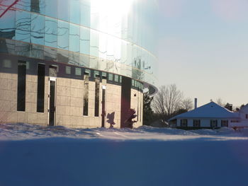 Built structure in winter against sky