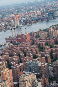 High angle view of river amidst buildings in city