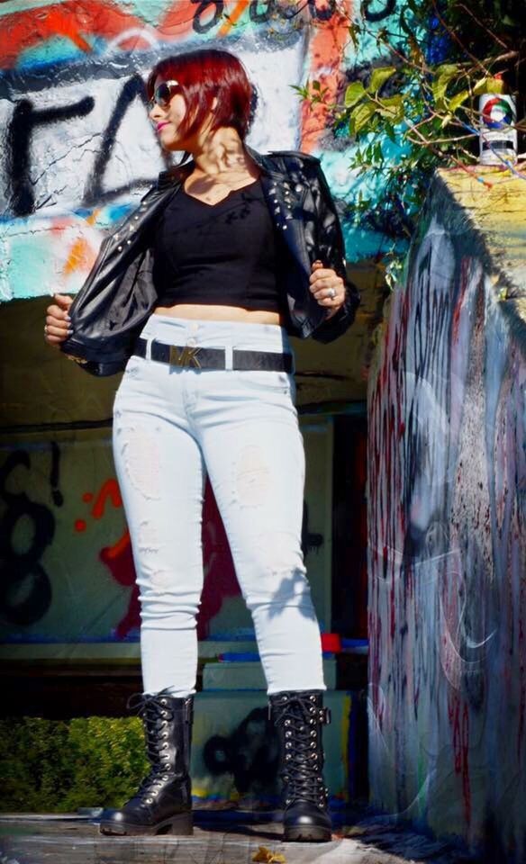 graffiti, one person, fashion, young adult, standing, lifestyles, casual clothing, street art, young women, front view, full length, beautiful woman, portrait, real people, cool attitude, dyed hair, multi colored, artist, one woman only, outdoors, day, adult, people, adults only